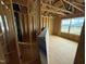 Unfinished new construction shows framing and a bright window at 3015 Dog Rose Drive Lot 170 Dr, Durham, NC 27703