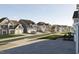 Scenic street view featuring a row of houses with manicured lawns and tree-lined sidewalks at 3015 Dog Rose Drive Lot 170 Dr, Durham, NC 27703