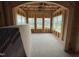 Bright sun room framed with wood, offering large windows and natural light at 3015 Dog Rose Drive Lot 170 Dr, Durham, NC 27703