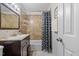 Updated bathroom with a patterned shower curtain and vanity at 304 22Nd St, Butner, NC 27509