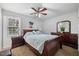 Bedroom featuring a ceiling fan, nightstands, and natural lighting at 304 22Nd St, Butner, NC 27509