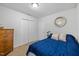 Cozy bedroom with carpet, closet and a side table at 304 22Nd St, Butner, NC 27509