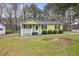 A cozy single-story home with a welcoming porch and manicured front yard at 304 22Nd St, Butner, NC 27509