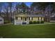 Charming single-story home features a covered porch, well-maintained lawn, and mature trees at 304 22Nd St, Butner, NC 27509