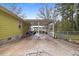 Rear view of the house featuring a covered patio and yard at 304 22Nd St, Butner, NC 27509