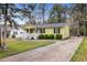 Charming one-story home featuring a covered front porch and driveway at 304 22Nd St, Butner, NC 27509