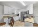 Well-lit kitchen with stainless steel appliances, granite countertops, and white cabinetry at 304 22Nd St, Butner, NC 27509
