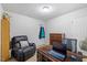 Cozy home office with a desk, recliner, and convenient storage solutions at 304 22Nd St, Butner, NC 27509
