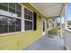 Covered porch with grey floors and a white railing at 304 22Nd St, Butner, NC 27509