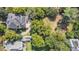 Aerial view showcasing the home's layout, backyard, and surrounding mature trees at 309 College St, Oxford, NC 27565