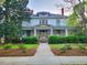 Charming two-story home with well-maintained landscaping and welcoming front porch at 309 College St, Oxford, NC 27565