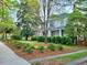Charming front exterior with a well-manicured lawn and mature trees, offering great curb appeal at 309 College St, Oxford, NC 27565