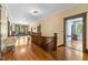 Second-floor hallway with hardwood floors and view into living room and bedroom at 309 College St, Oxford, NC 27565