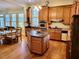 Spacious kitchen featuring custom cabinets, center island, and stainless steel appliances at 309 College St, Oxford, NC 27565
