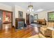 Cozy living room with hardwood floors, fireplace and vintage armchairs at 309 College St, Oxford, NC 27565
