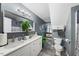 Bathroom with double sinks, granite countertops, gray walls, and modern fixtures at 3222 Windmere Dr, Sanford, NC 27330