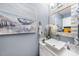 Stylish bathroom featuring a vessel sink, decorative mirror, and coastal-inspired decor at 3222 Windmere Dr, Sanford, NC 27330