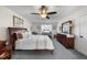 Bedroom with a ceiling fan, a brown wooden dresser, and a wooden bed at 3222 Windmere Dr, Sanford, NC 27330