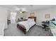 Bedroom with a ceiling fan, a gray carpet, and an adjacent desk working space at 3222 Windmere Dr, Sanford, NC 27330