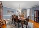 Formal dining room featuring hardwood floors, elegant furnishings, decorative rug, and natural light at 3222 Windmere Dr, Sanford, NC 27330
