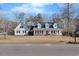 Beautiful two-story home with a well-manicured lawn and an inviting front porch at 3222 Windmere Dr, Sanford, NC 27330