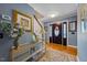 Elegant foyer featuring hardwood floors, a staircase, and tasteful decor at 3222 Windmere Dr, Sanford, NC 27330