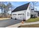 Two-car garage with white doors and black hardware, attached to the home via a connecting driveway at 3222 Windmere Dr, Sanford, NC 27330