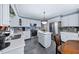 Open kitchen with island, stainless steel appliances and modern finishes at 3222 Windmere Dr, Sanford, NC 27330