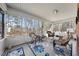 The sunroom with wicker chairs, a ceiling fan, and a large area rug at 3222 Windmere Dr, Sanford, NC 27330