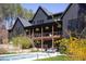 Home features an inground pool, lush landscaping, and a covered porch for outdoor relaxation at 336 Timberline Dr, Pittsboro, NC 27312