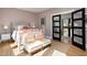 Comfortable bedroom with a doorway view, accent chairs, neutral color walls, and natural light at 336 Timberline Dr, Pittsboro, NC 27312
