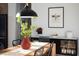 Well-lit dining area featuring a decorative red vase centerpiece and black modern-style furniture at 336 Timberline Dr, Pittsboro, NC 27312