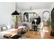 Open dining and living room with chandelier and hardwood floors at 336 Timberline Dr, Pittsboro, NC 27312