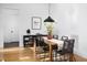 Stylish dining area with black furniture, modern pendant lighting, and elegant décor at 336 Timberline Dr, Pittsboro, NC 27312