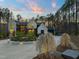 Elegant two-story home with a circular driveway, manicured landscaping, and exterior lighting at 336 Timberline Dr, Pittsboro, NC 27312