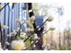 Close-up capturing the delicate beauty of blooming flowers against the backdrop of a home's dark siding at 336 Timberline Dr, Pittsboro, NC 27312