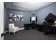 This gaming room features stylish decor, a large desk, and comfortable seating for an immersive gaming experience at 336 Timberline Dr, Pittsboro, NC 27312