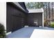 Modern black garage doors with sleek windows, complementing the home's contemporary exterior and design at 336 Timberline Dr, Pittsboro, NC 27312