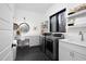 Bright laundry room with modern appliances, ample storage, and a built-in workspace at 336 Timberline Dr, Pittsboro, NC 27312