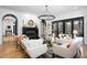 Bright living room with hardwood floors and modern chandelier at 336 Timberline Dr, Pittsboro, NC 27312