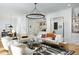 Spacious living room with hardwood floors and modern chandelier at 336 Timberline Dr, Pittsboro, NC 27312