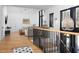 Bright living room with hardwood floors, white walls, black trim windows and modern furnishings at 336 Timberline Dr, Pittsboro, NC 27312