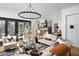 Spacious living room featuring a modern chandelier and open floor plan at 336 Timberline Dr, Pittsboro, NC 27312