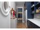 Mud room with navy blue cabinets and stainless steel refrigerator at 336 Timberline Dr, Pittsboro, NC 27312