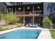 Expansive backyard with pool, patio, and well-maintained landscaping for relaxing and entertaining at 336 Timberline Dr, Pittsboro, NC 27312