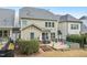 Well-maintained backyard featuring a stone patio, grilling area, garden plots and green space at 3929 Glenlake Garden Dr, Raleigh, NC 27612
