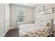 Serene bedroom with a cozy bed, a neutral color scheme, and ample natural light at 3929 Glenlake Garden Dr, Raleigh, NC 27612