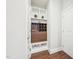 Hallway featuring a built in wine storage unit and decorative plants, creating a stylish and functional space at 3929 Glenlake Garden Dr, Raleigh, NC 27612