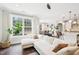 Open-concept living space with a sectional sofa, hardwood floors, and seamless flow to the dining and kitchen areas at 3929 Glenlake Garden Dr, Raleigh, NC 27612