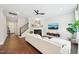 Stylish living room featuring a fireplace, hardwood floors, and a staircase leading to the upper level at 3929 Glenlake Garden Dr, Raleigh, NC 27612